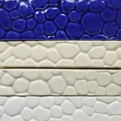 trim tile, pebble trim tile, pebble-look trim tile, hand made tile, ceramic tile